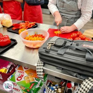 cutting vegetables; Teaching expectations for cooking with a guest chef